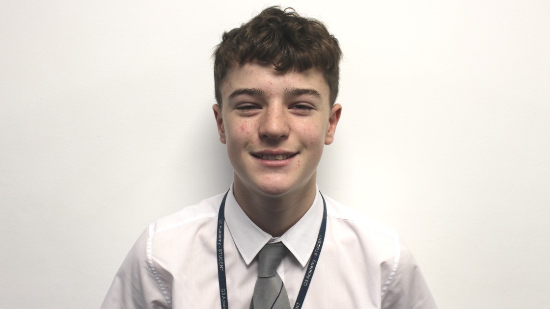 Student in school uniform smiling